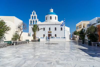 Orthodox church in oia, santorini, greece, on a summer day. summer 2020, during coronavirus pandemic