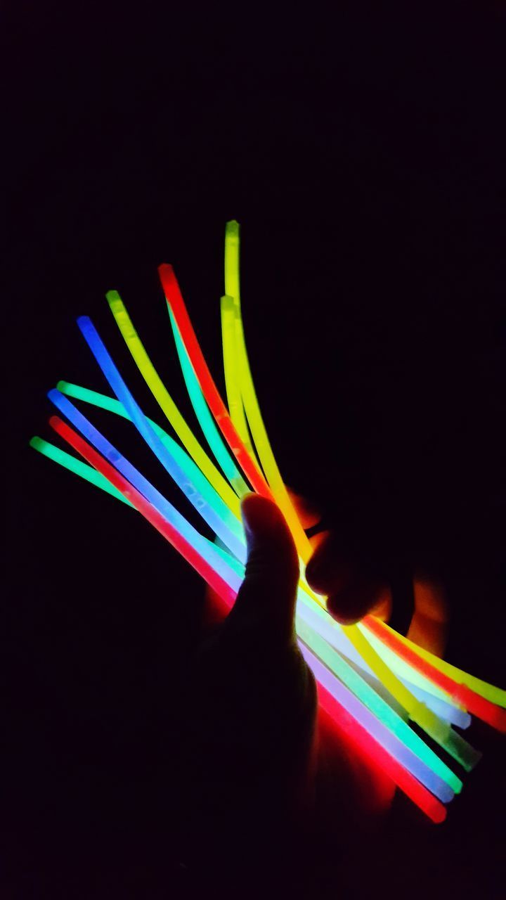 CLOSE-UP OF MULTI COLORED ILLUMINATED LIGHTS AGAINST BLACK BACKGROUND