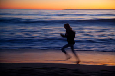 Scenic view of sea at sunset