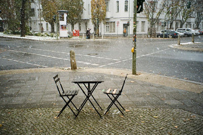 High angle view of empty chairs on street