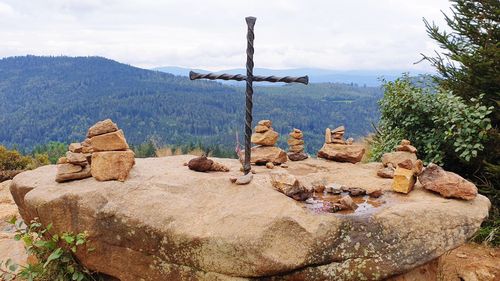 Panoramic view of rocks on shore against sky