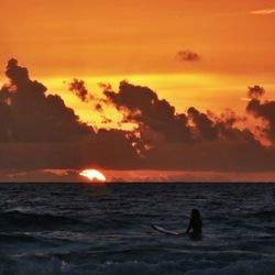 Scenic view of sea at sunset