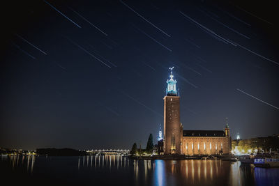 Star trails over city at night