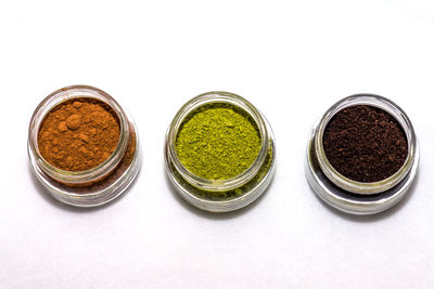 High angle view of spices against white background