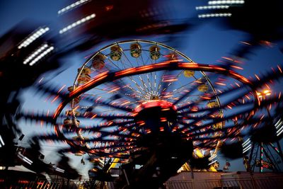 Low angle view of ferris wheel against sky at night