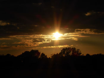 Scenic view of silhouette landscape against sky during sunset