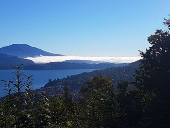 Scenic view of mountains against clear blue sky