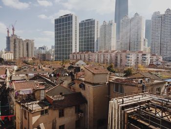 Modern buildings in city against sky