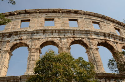 Low angle view of coluseum in pula