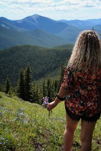 Rear view of woman looking at mountains