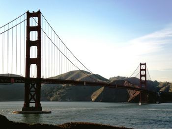 Golden gate bridge over sea against sky