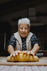 Man holding ice cream on table