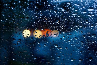 Close-up of water drops on glass