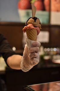 Close-up of hand holding ice cream