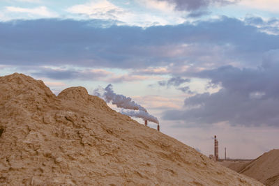 Scenic view of desert against sky