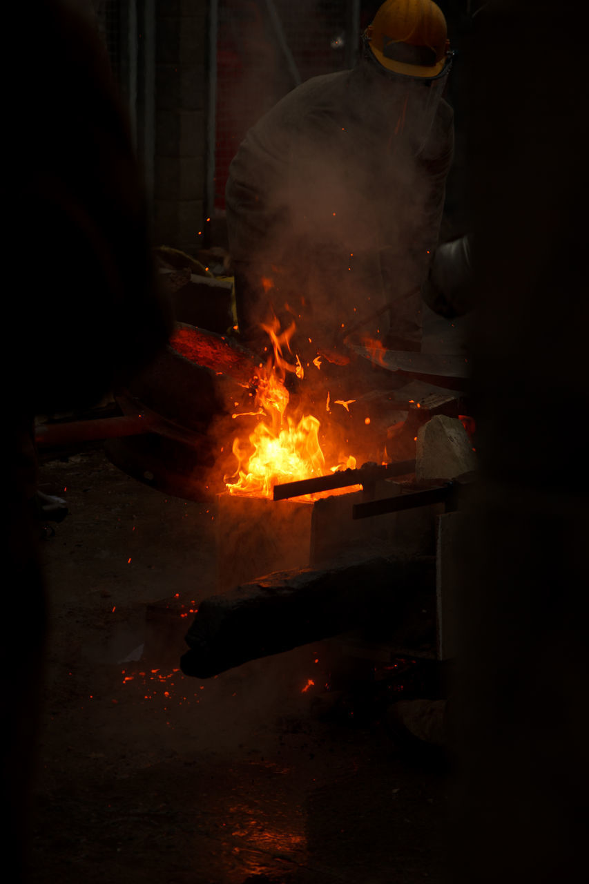 MAN WORKING IN FIRE