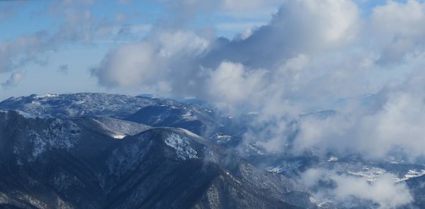 Scenic view of snowcapped mountains against sky