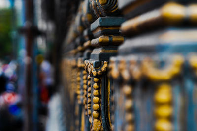 Close-up of rope tied to metal structure in market