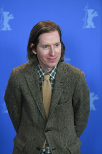 Portrait of smiling man against blue background