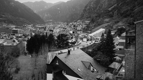 High angle view of townscape by mountains