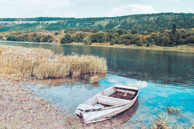 Moored wooden boat . rustic fishing , image in retro style