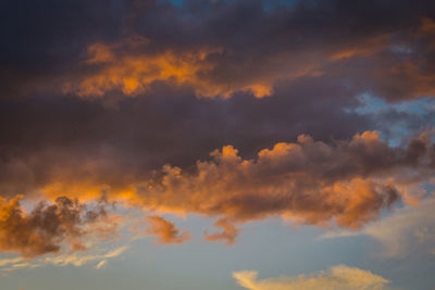 Low angle view of dramatic sky during sunset