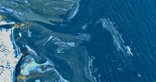 High angle view of snow on sea shore