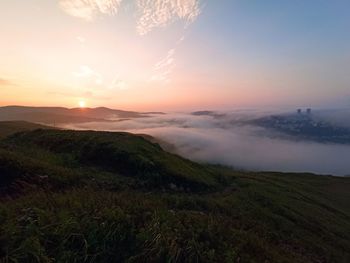 Scenic view of landscape against sky during sunset