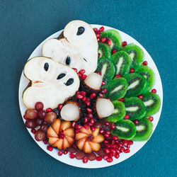 High angle view of fruits in plate on table