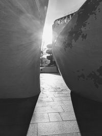 Footpath amidst buildings against sky