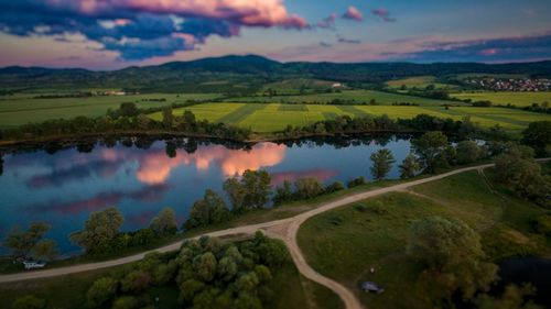 Scenic view of field against sky during sunset