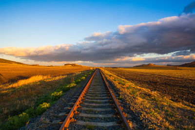 Scenic view of field against sky during sunset