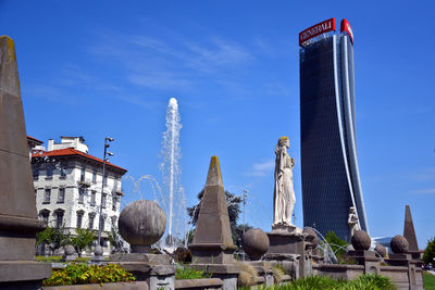 Low angle view of statue against historic building