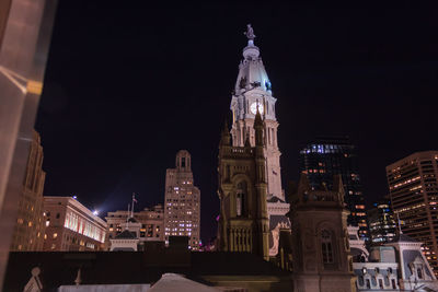 Illuminated cathedral against sky at night