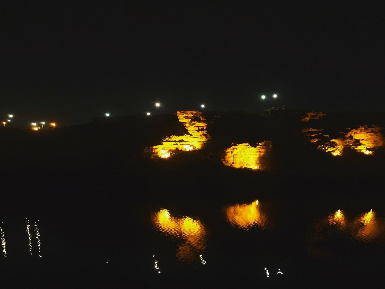 VIEW OF ILLUMINATED BUILDINGS AT NIGHT