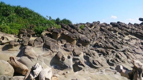 View of rocks against clear sky