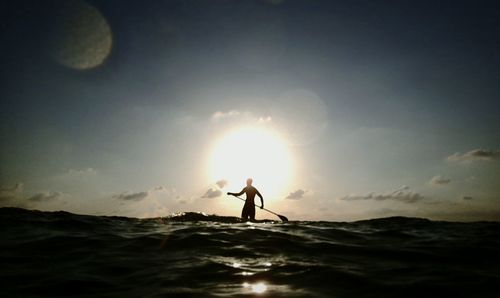 Silhouette of people on beach