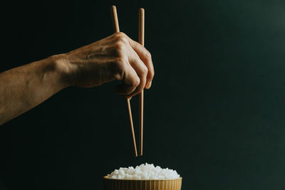 Close-up of hand holding ice cream