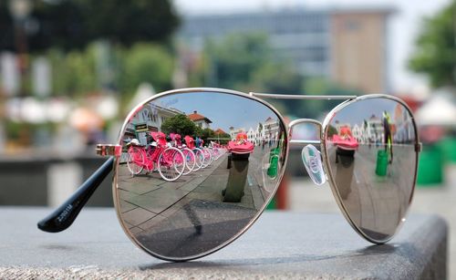 Close-up of sunglasses on glass table