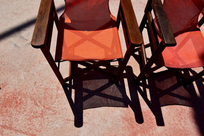 High angle view of empty chairs and table in restaurant