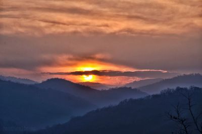 Scenic view of silhouette mountain against sky during sunset