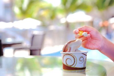 Close-up of woman holding ice cream