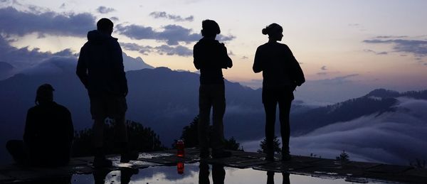 Silhouette people at sunset