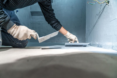 Midsection of man working at workshop