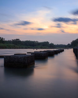 Scenic view of lake against sky during sunset