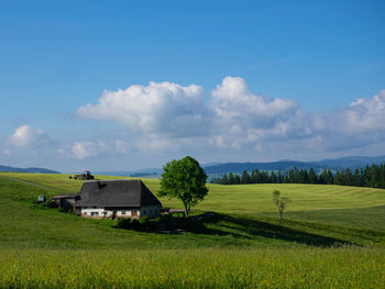 House on field against sky