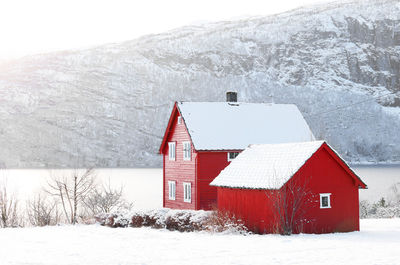 House on snow covered field