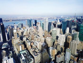 Aerial view of modern buildings in city against sky