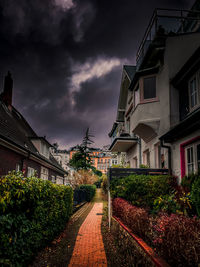 Street amidst buildings against sky