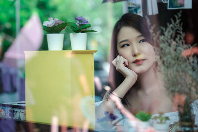 Portrait of a young woman looking away